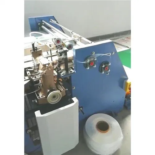 Mesin Pemotong dan Jahit Berkembar Berkembar